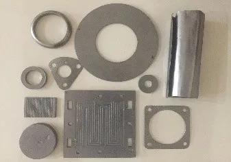 Digital photograph of EG based material compacted in various shapes